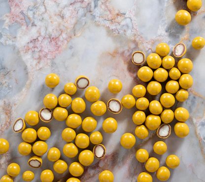 Milk Choc & Passionfruit Coated Macadamias 150g